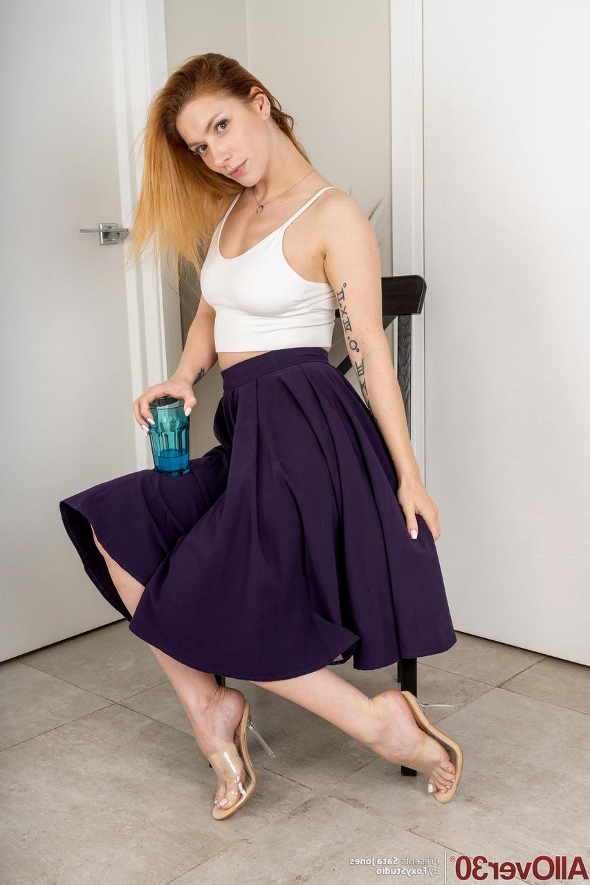 15P 30 plus redhead Sata Jones gets naked for the first time on a chair