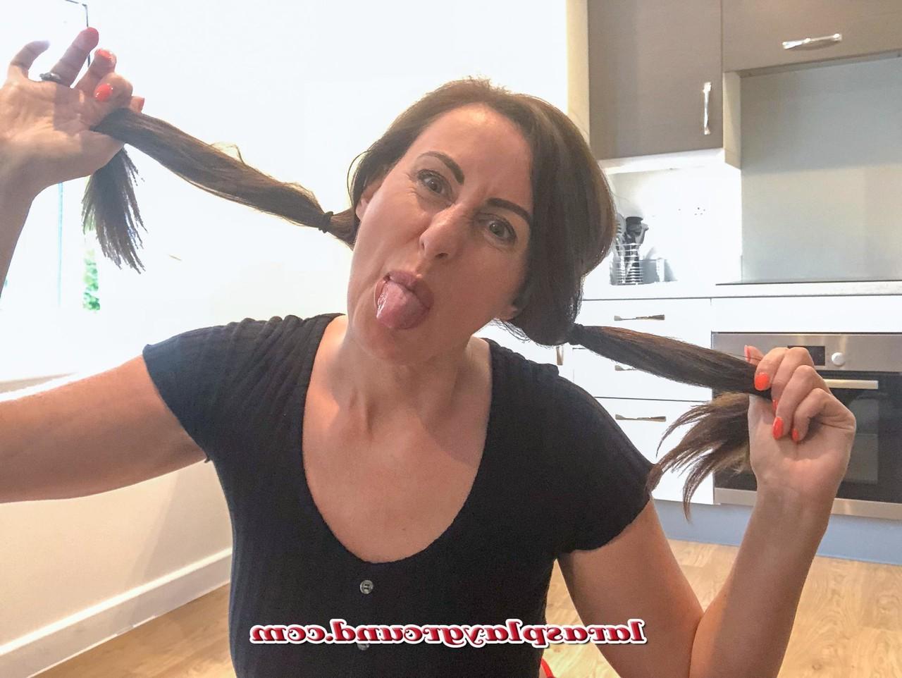 15P MILF Lara shows her big ass while posing in a schoolgirl outfit & stockings