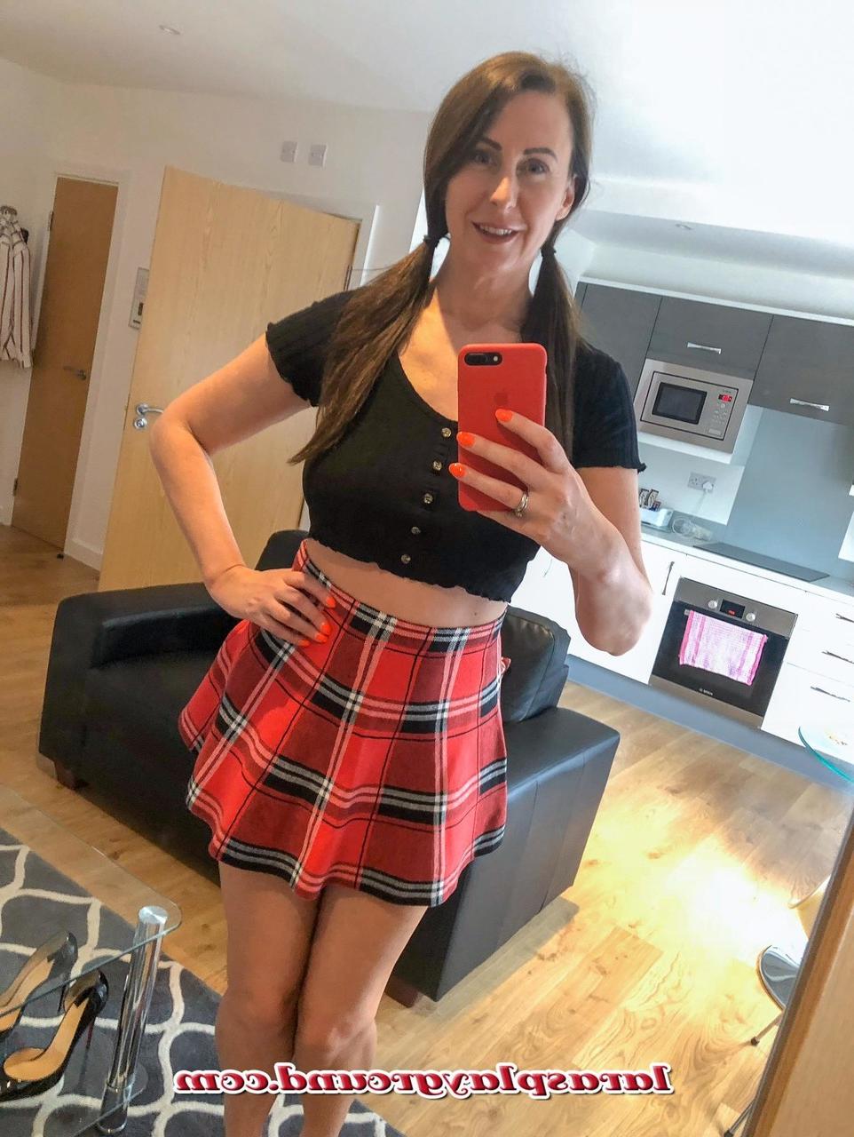 15P MILF Lara shows her big ass while posing in a schoolgirl outfit & stockings