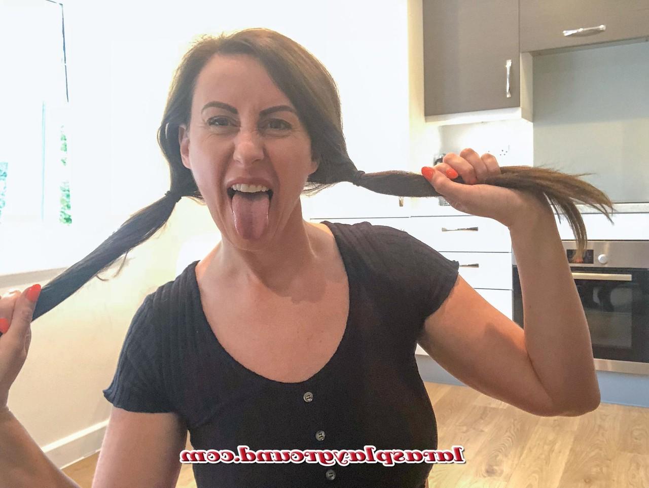15P MILF Lara shows her big ass while posing in a schoolgirl outfit & stockings