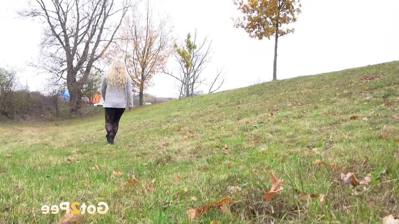 15P Chubby blonde Henriet gets caught taking a pee in an outdoor location