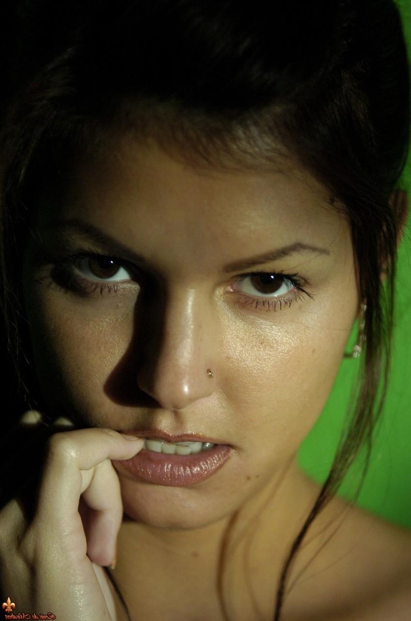 16P Alluring brunette Lucky gets naked in stockings against a wall in poor light