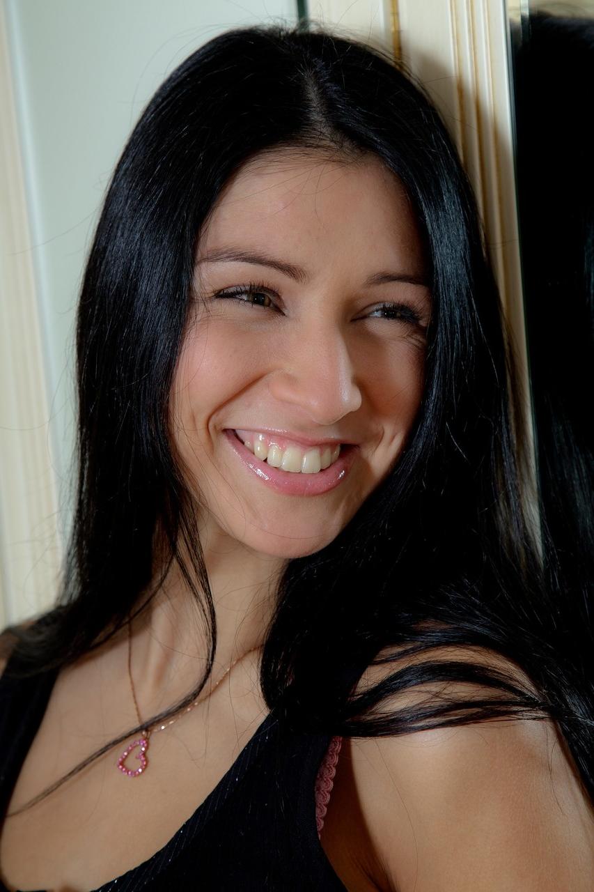 20P Brunette Elizabeth with long legs plays with her big flesh-colored dildo