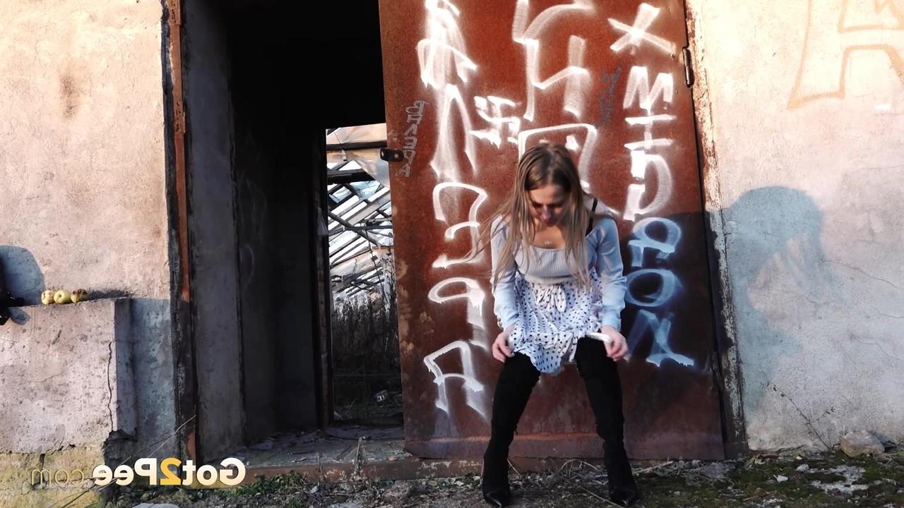 15P Pretty girl Nastya ducks behind an abandoned building for a badly needed piss
