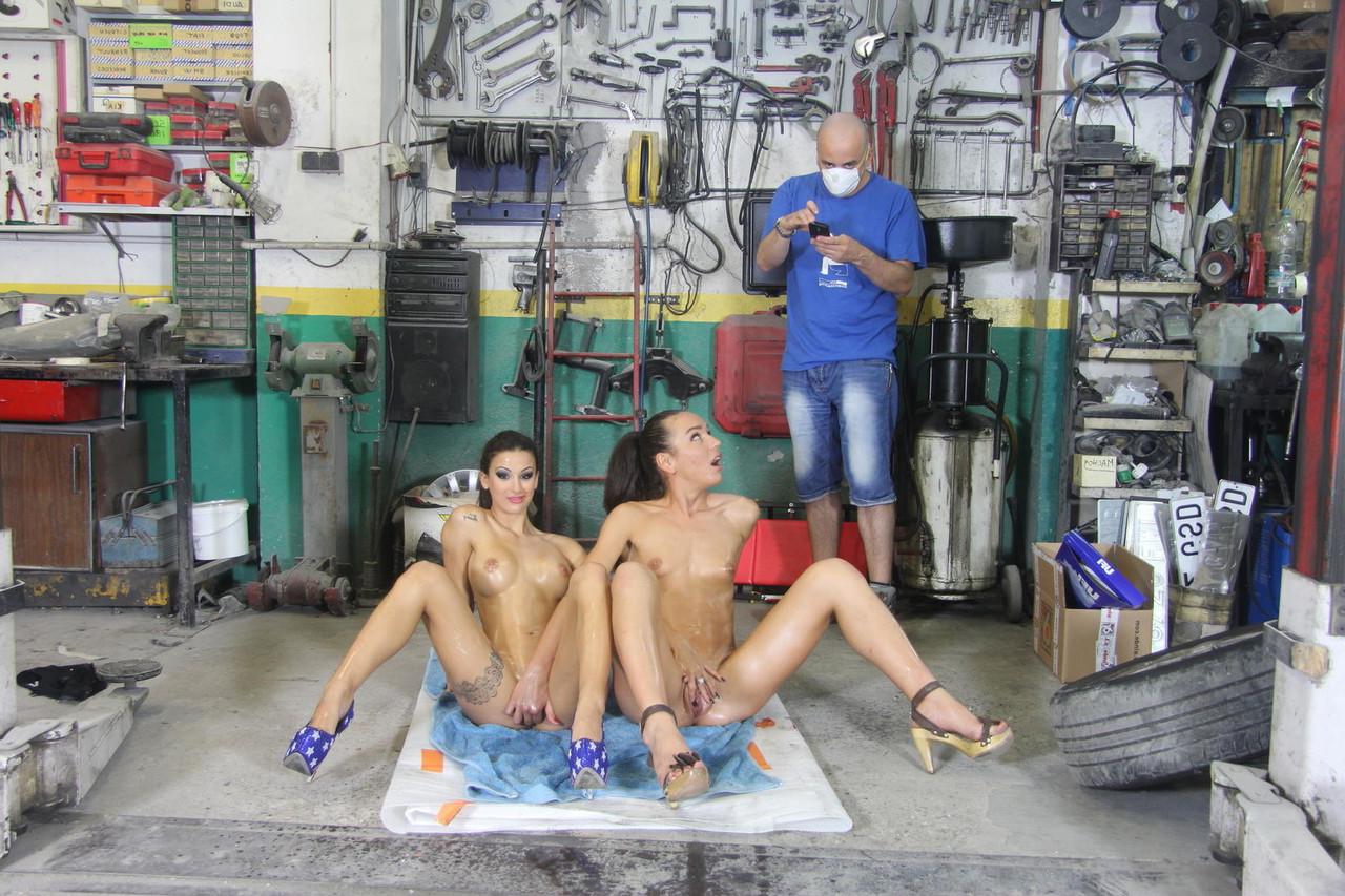 18P Horny garage groupies strip down and oil up to spread ass on their knees