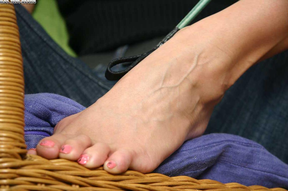 16P Caucasian woman smokes while spreading her toes during non-nude action