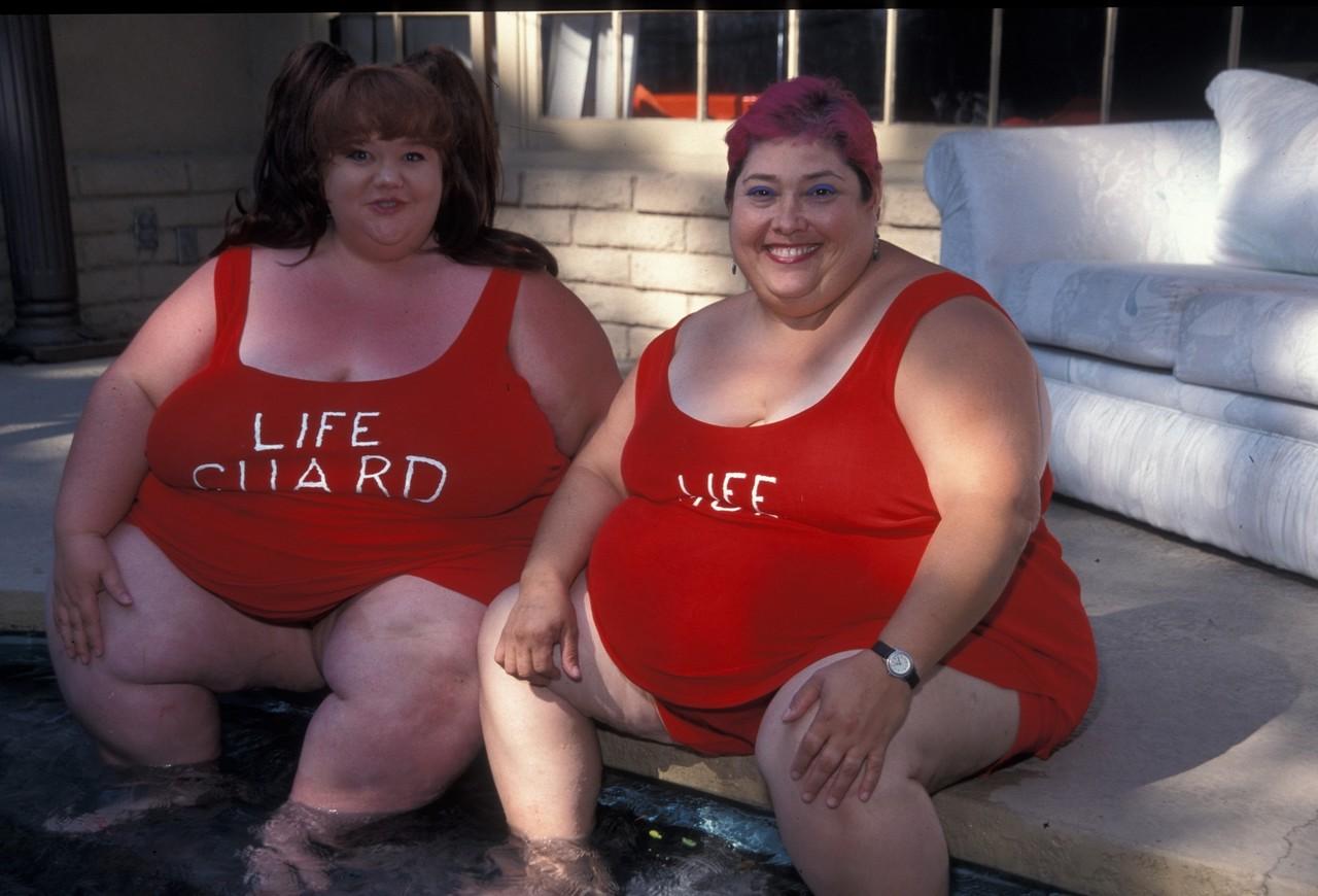 20P Redheaded fatty Clarissa Yoder displays her huge saggy tits while posing naked