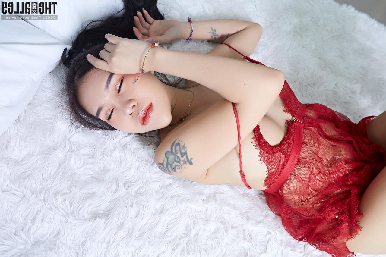 16P Beautiful Asian girl Parissa discards red lingerie prior to masturbating