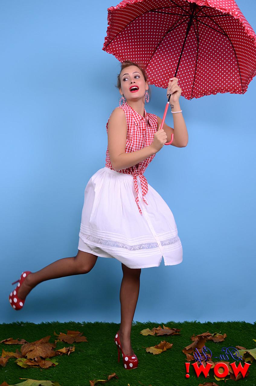 17P Pinup model Kelli Smith loses her clothes and hose while holding an umbrella