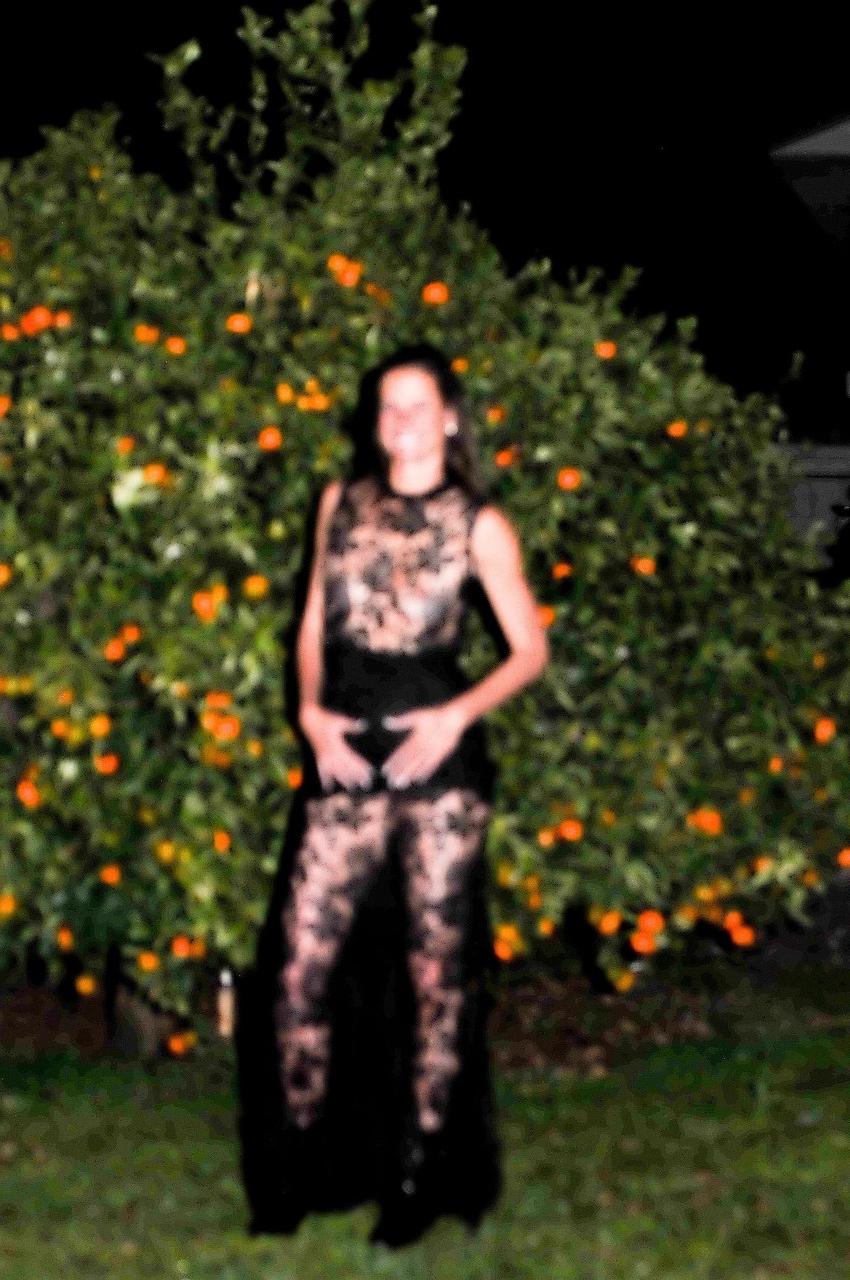 20P Brunette widow Sofie Marie flaunts her big ass while posing in her lace dress