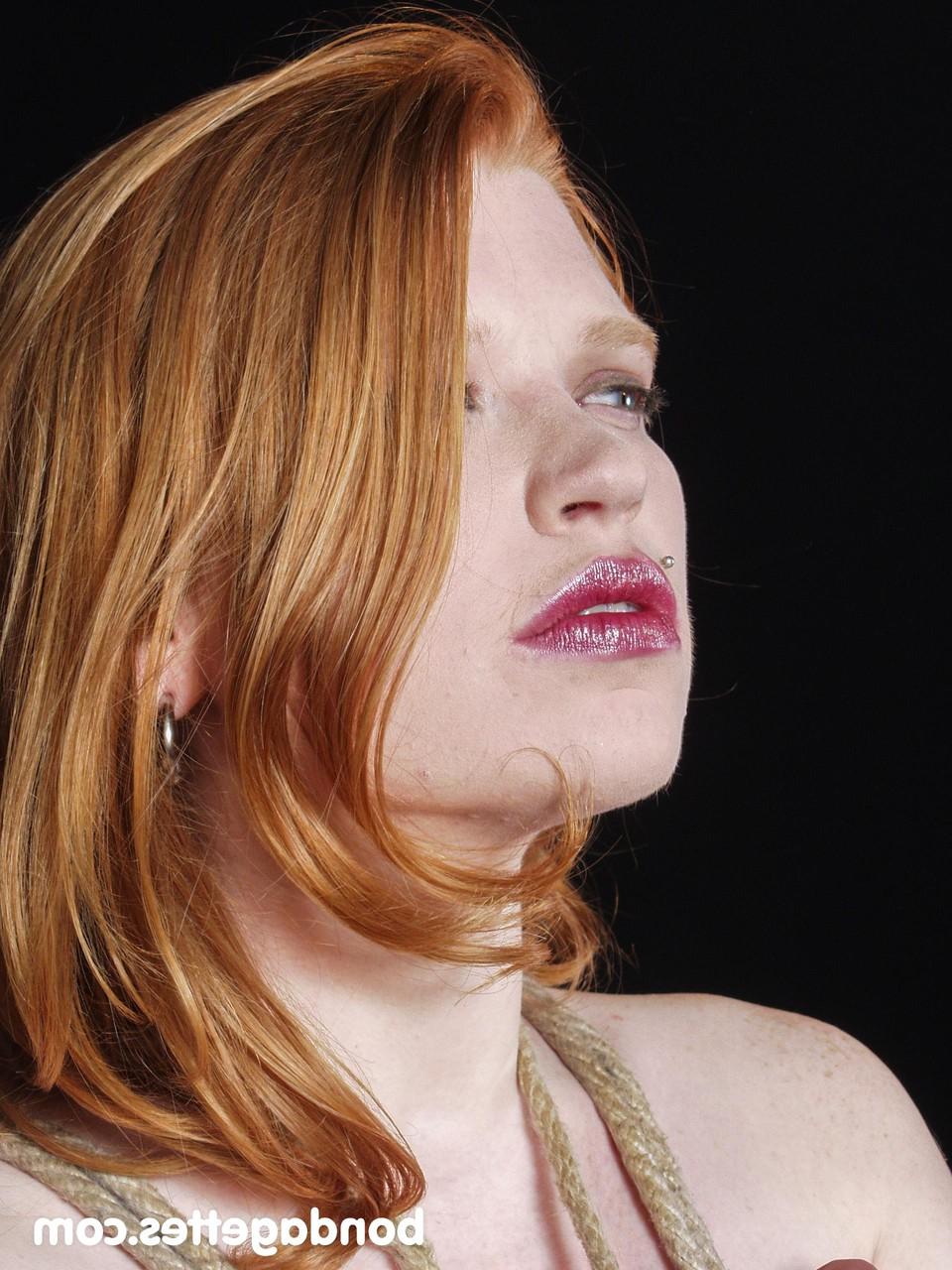 20P Gorgeous redhead Madison Lux gets tied up in rope bondage while naked