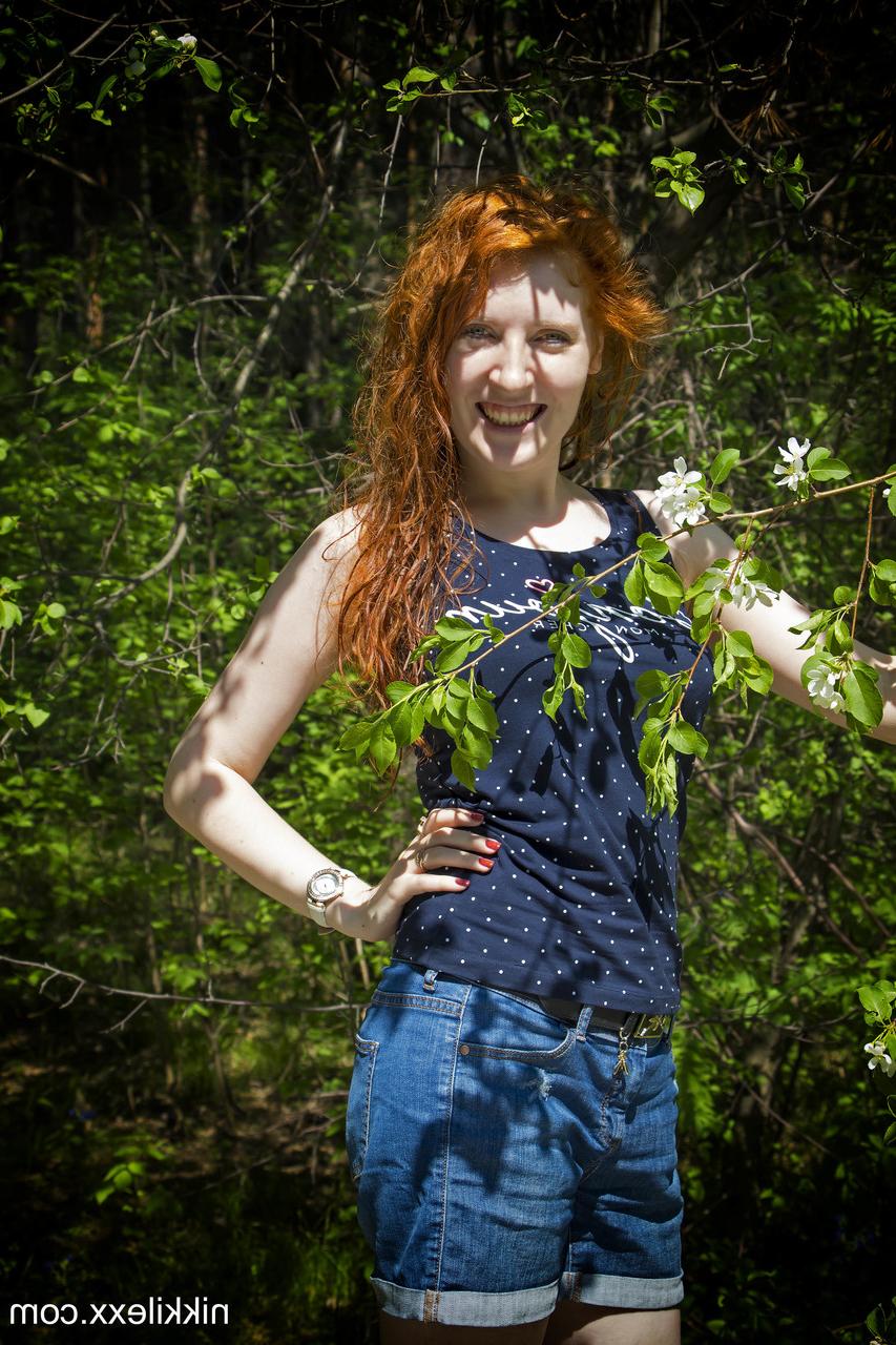 15P Hot redheaded amateur MILF Nikki Lexx strips & flaunts her big tits in nature