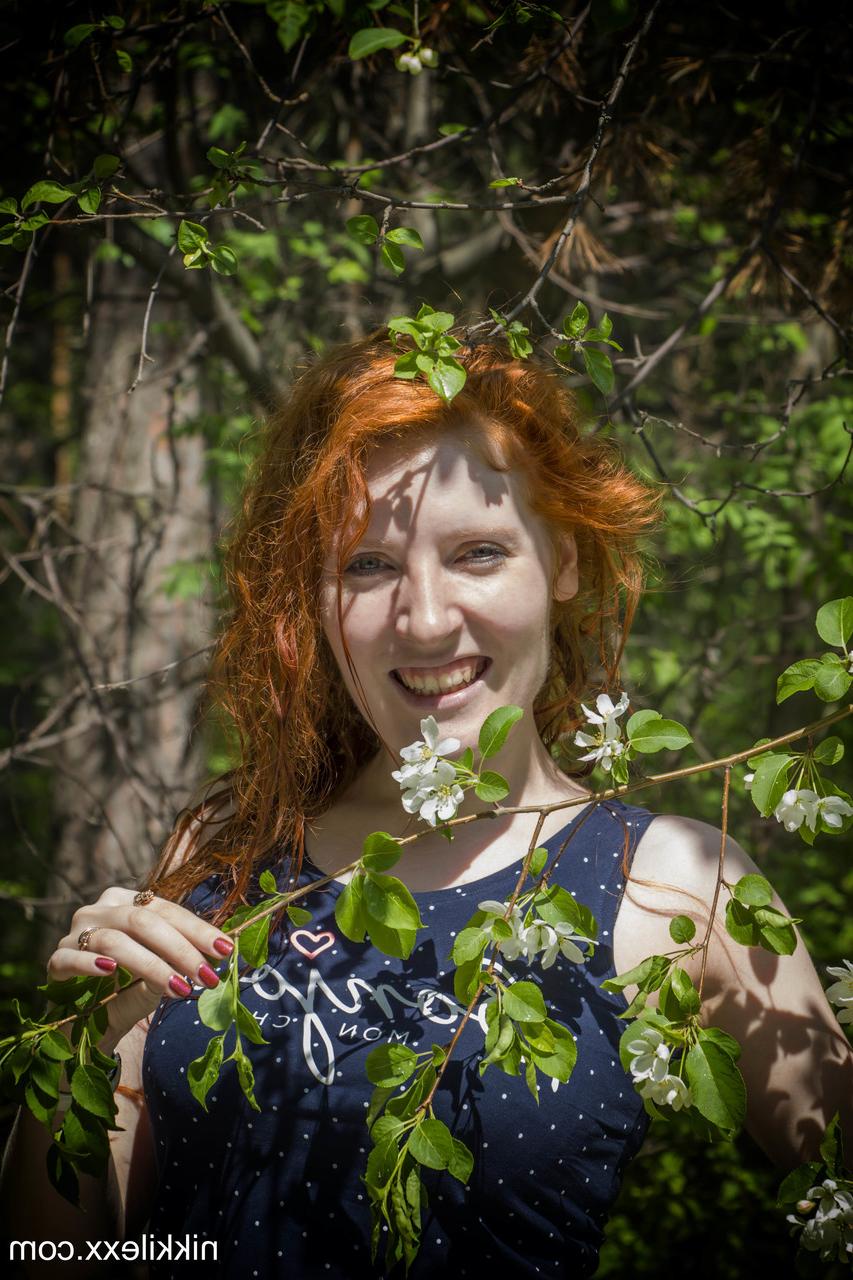 15P Hot redheaded amateur MILF Nikki Lexx strips & flaunts her big tits in nature