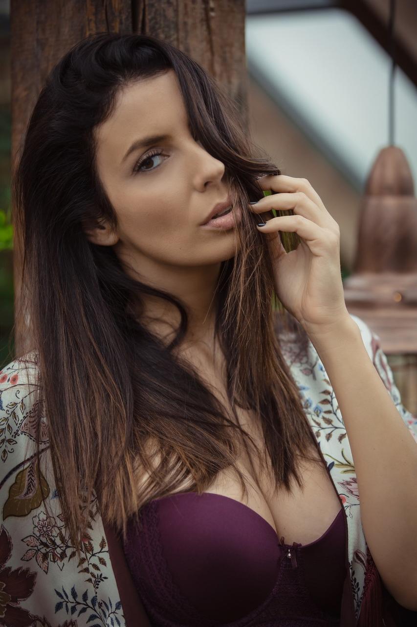 20P Breathtaking babe Katey stripping and exposing her big boobs in the greenhouse