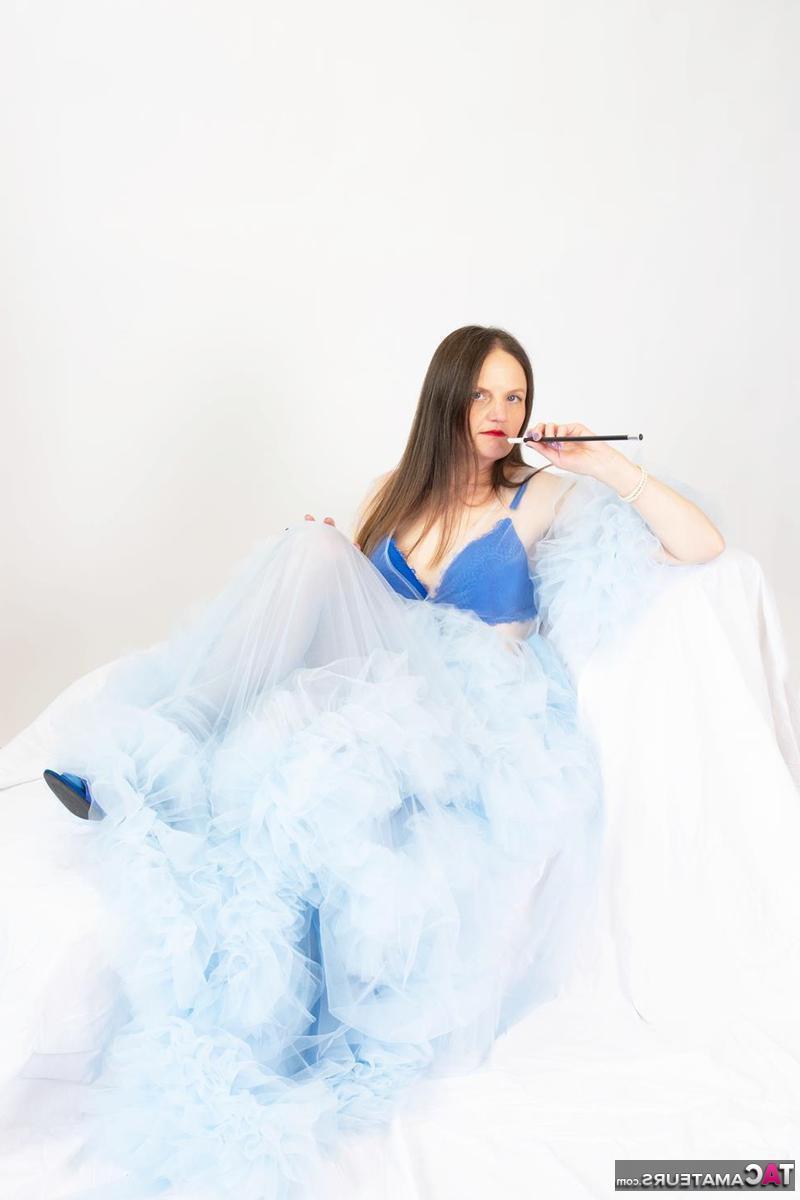 16P Aged lady Reckless Temptation holds a cigarette holder while attracting a man