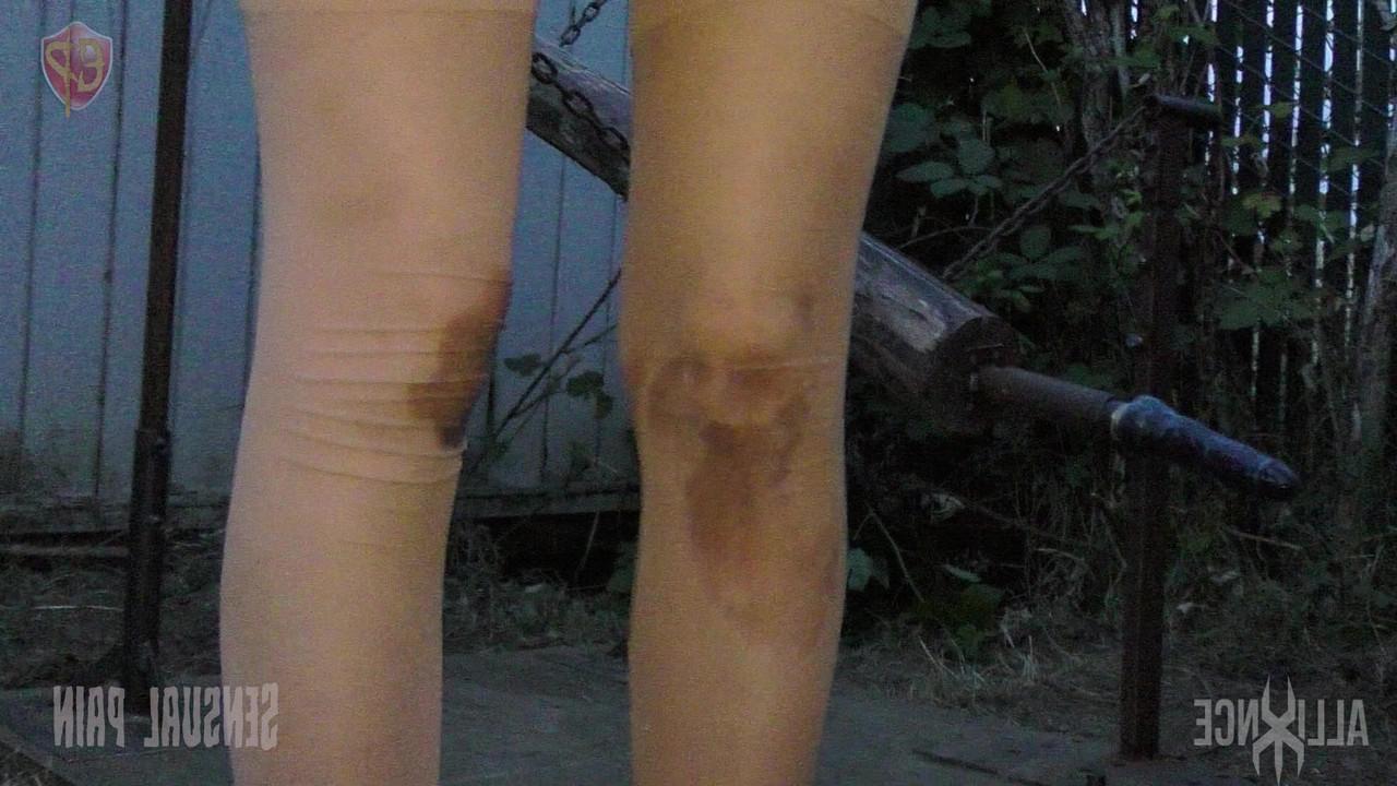 14P Female submissive Abigail Dupree is locked in a hole before being caned