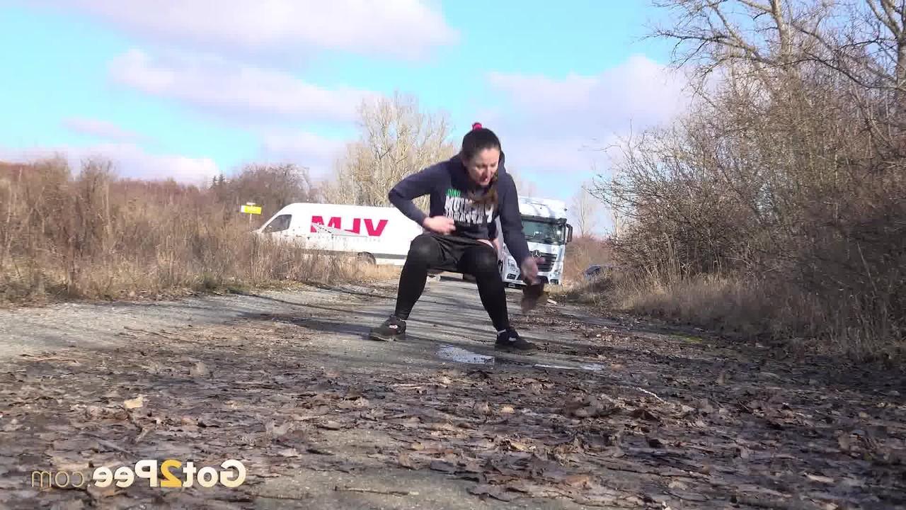 15P Valentina Ross pulls down her leggings to piss on a side road near an overpass