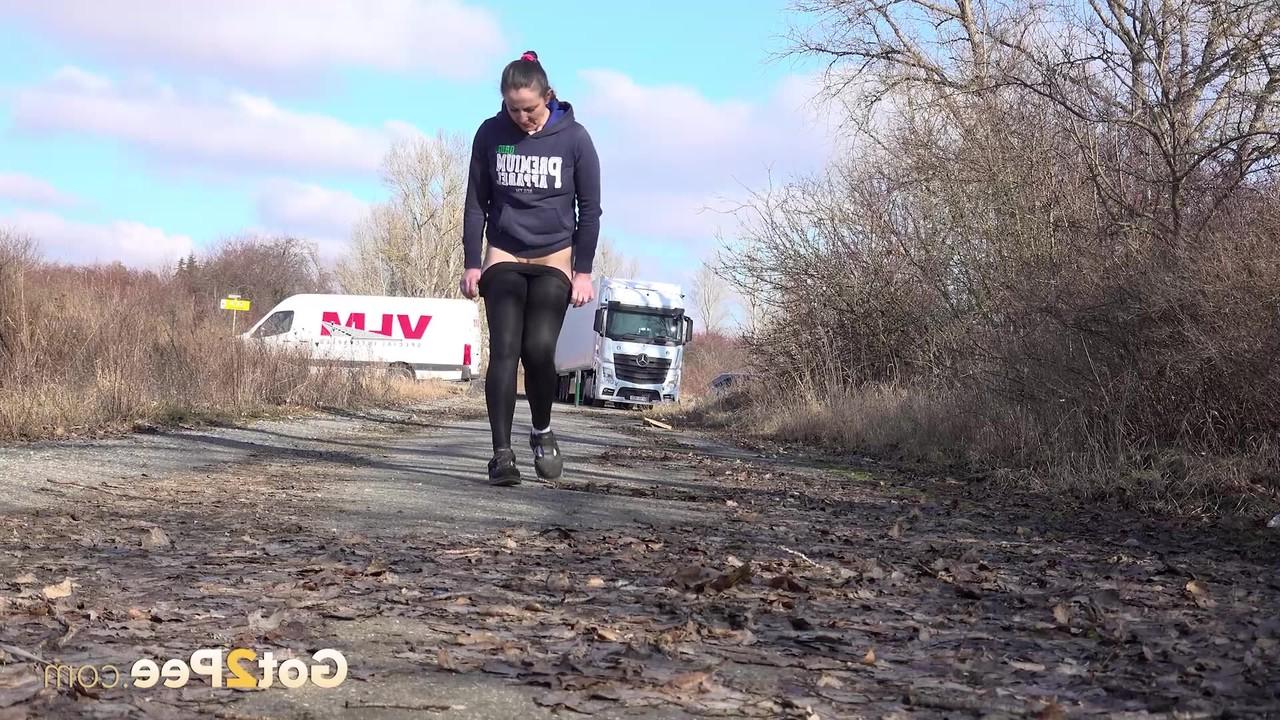 15P Valentina Ross pulls down her leggings to piss on a side road near an overpass