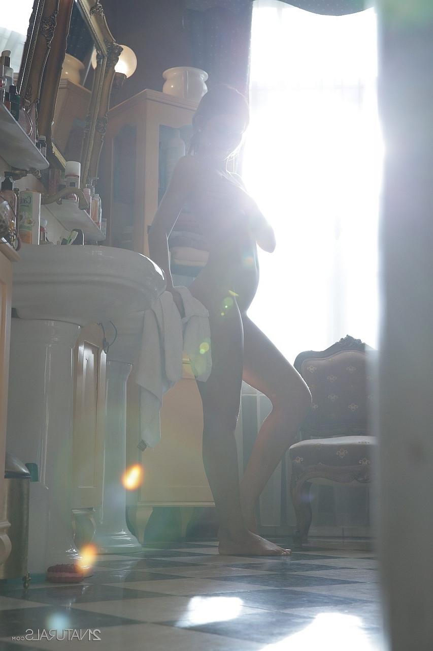 18P Brunette Hungarian babe Alexis Brill takes a bath and rubs her tight slit