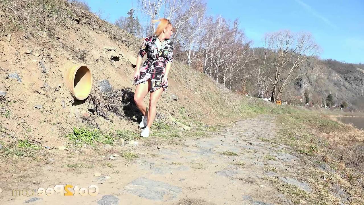 15P Chrissy Fox takes a piss during a walk in the countryside
