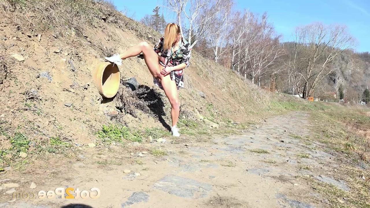 15P Chrissy Fox takes a piss during a walk in the countryside