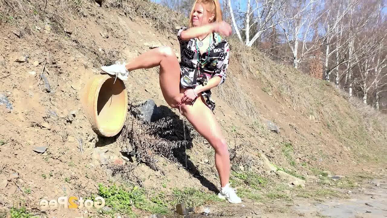 15P Chrissy Fox takes a piss during a walk in the countryside
