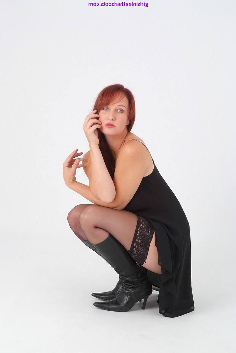 15P Natural redhead Sammy bares her black panties & stocking tops in leather boots