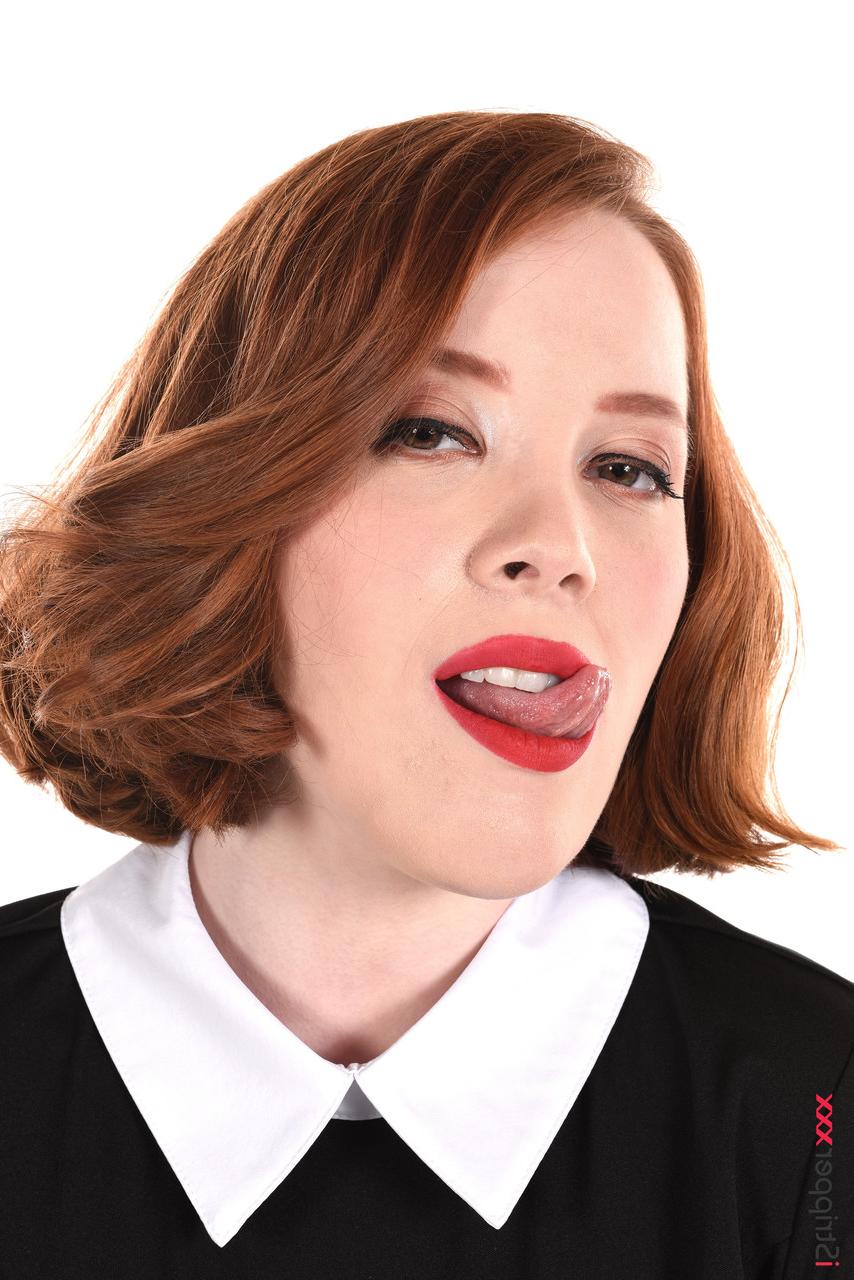 15P Natural redhead Lottie Magne licks a dildo while studying a chessboard