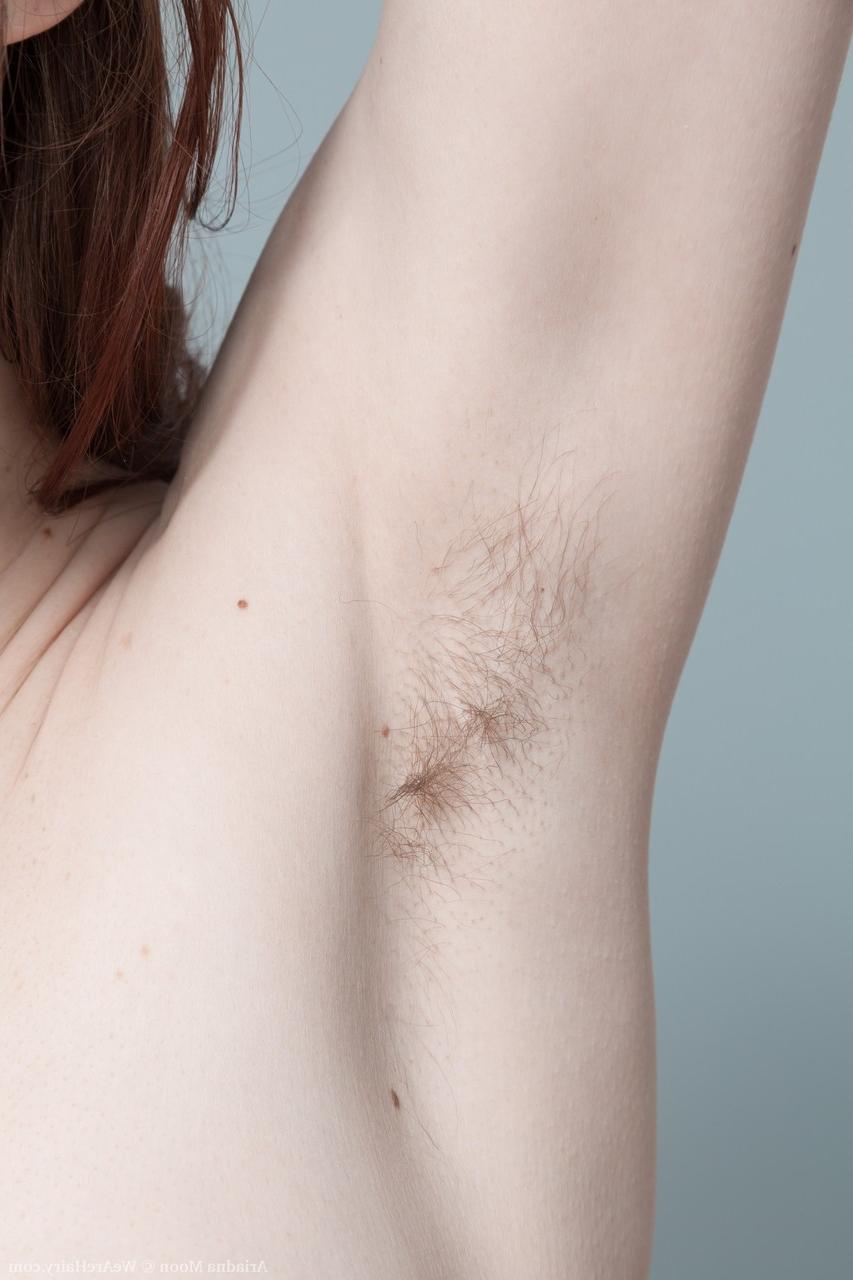 18P Pale redhead Ariadna Moon shows hairy armpits & toys her furry hole on the bed