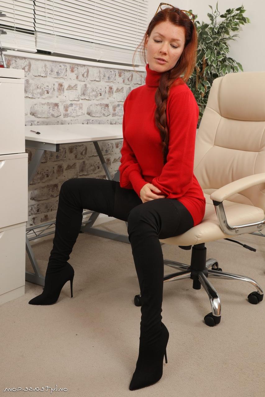 16P Natural redhead Mia S goes topless on a desk chair in dark pantyhose