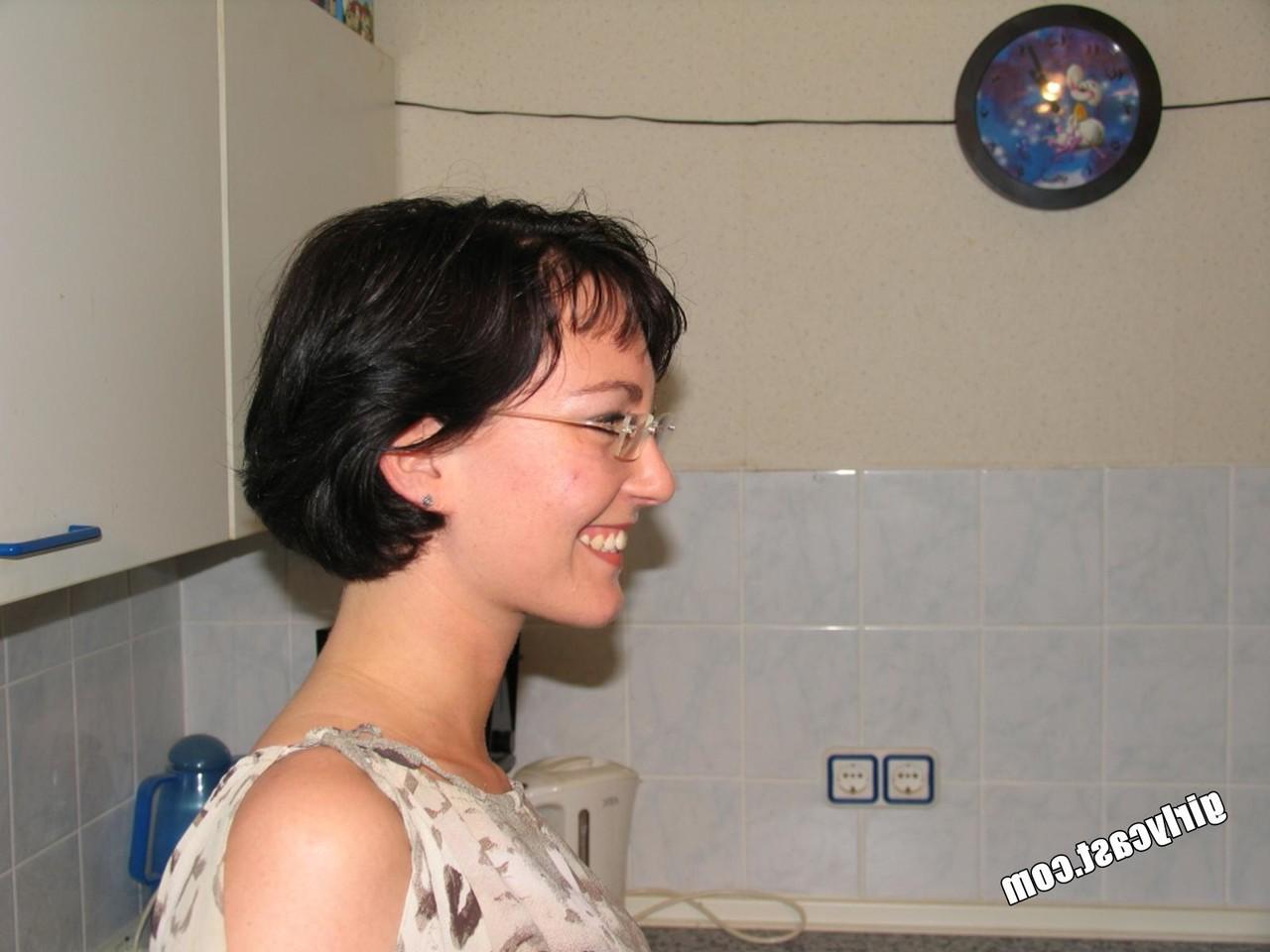 15P Nerdy brunette strips to pointy shoes with a sex toy in her hands