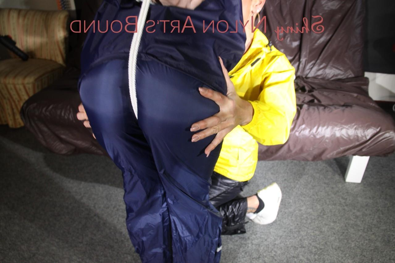 16P Submissive girl receives a kiss while restrained by her lesbian lover