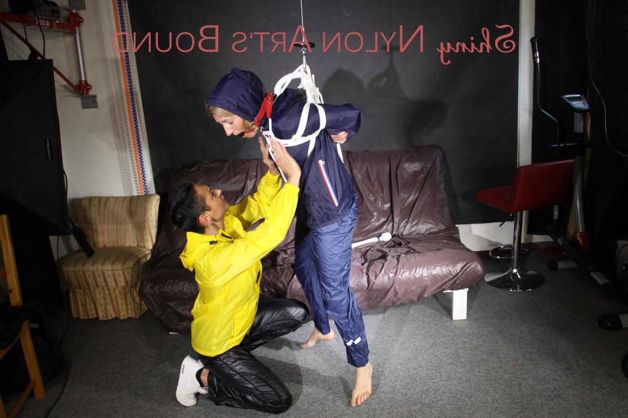 16P Submissive girl receives a kiss while restrained by her lesbian lover