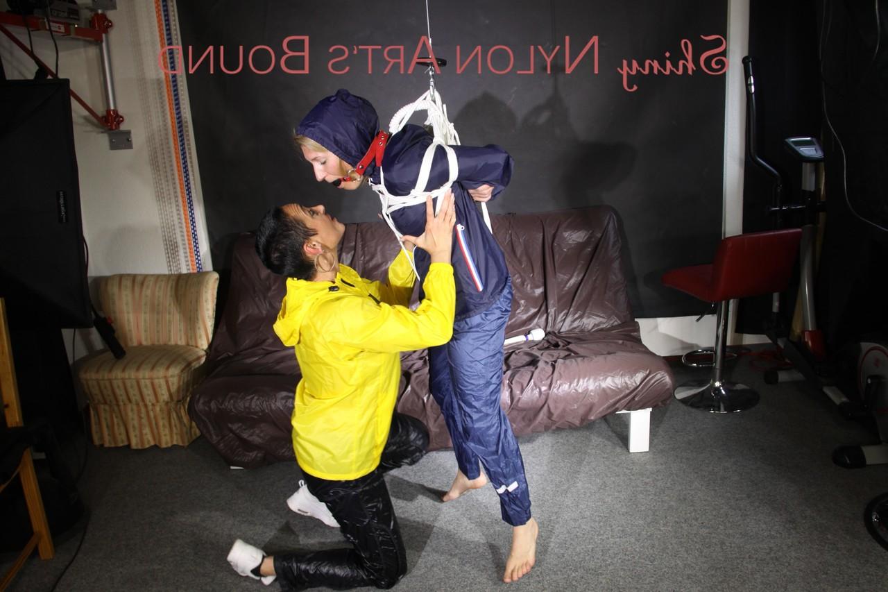 16P Submissive girl receives a kiss while restrained by her lesbian lover