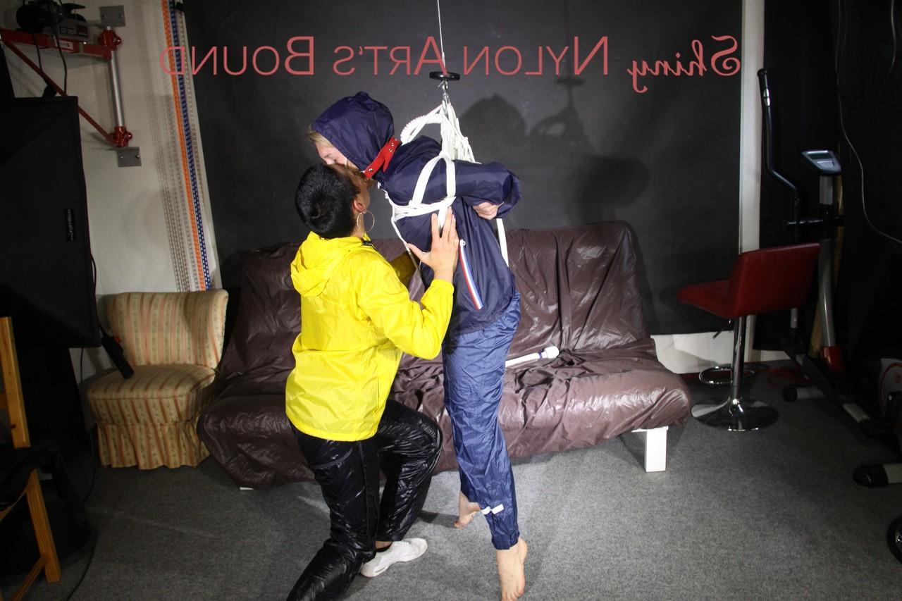 16P Submissive girl receives a kiss while restrained by her lesbian lover