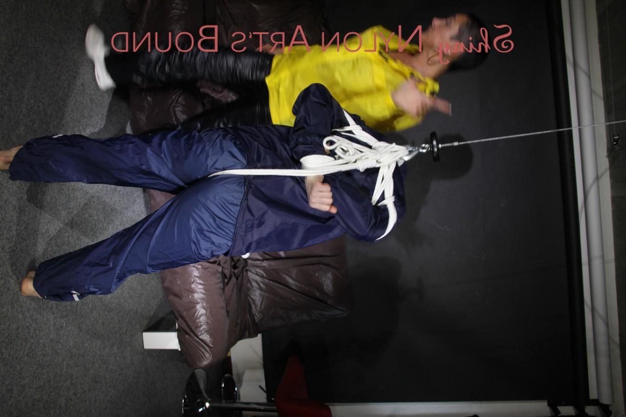 16P Submissive girl receives a kiss while restrained by her lesbian lover