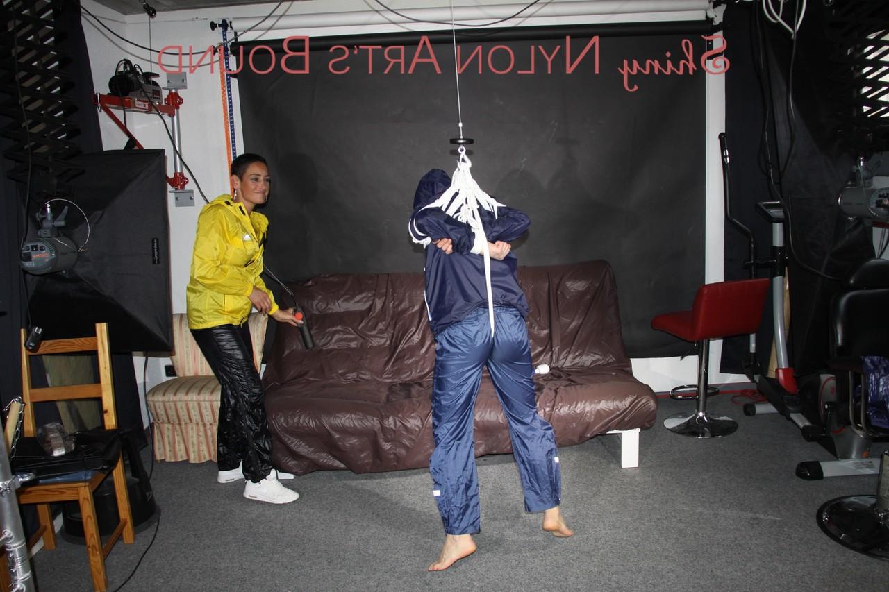 16P Submissive girl receives a kiss while restrained by her lesbian lover