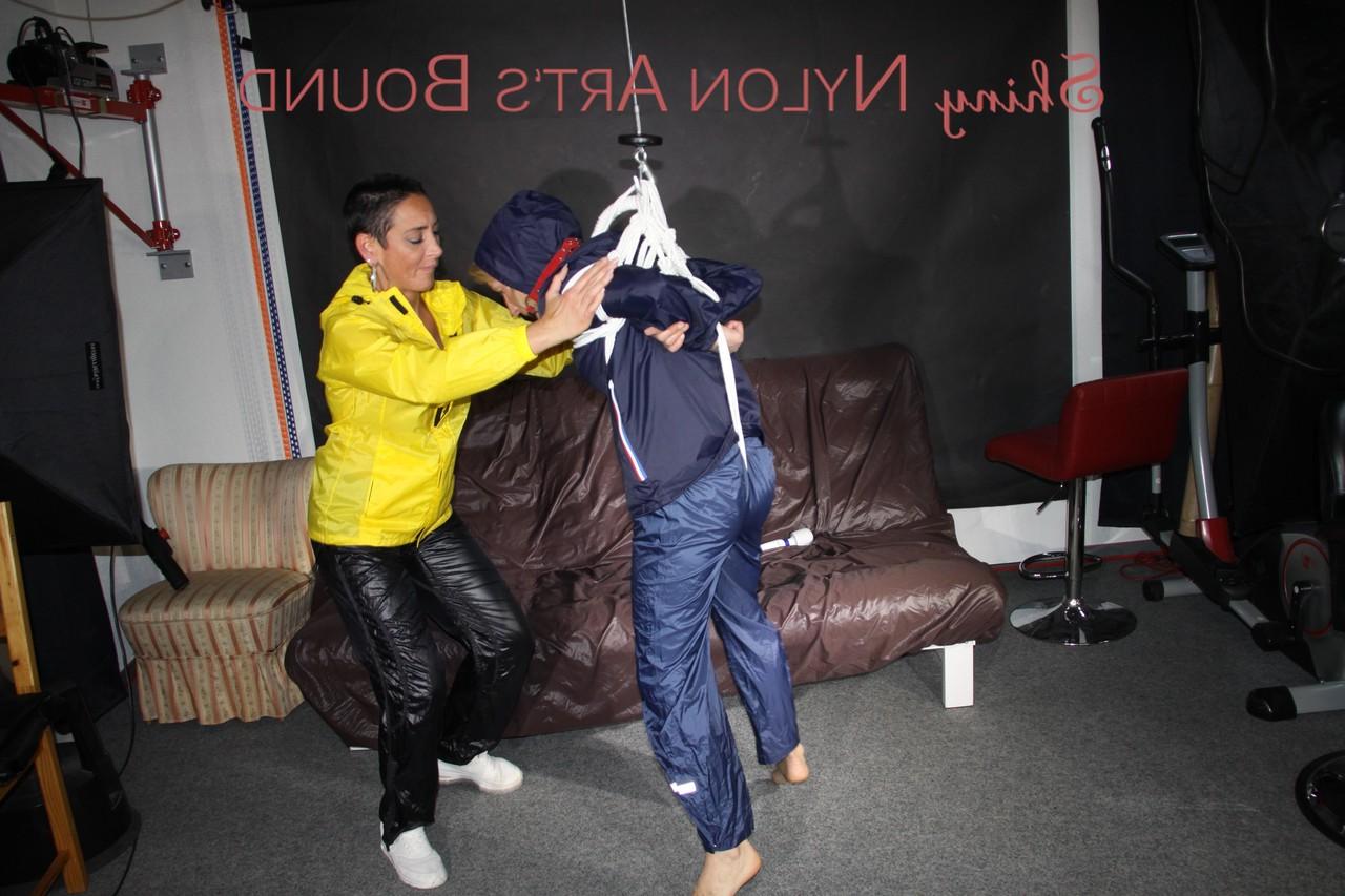 16P Submissive girl receives a kiss while restrained by her lesbian lover