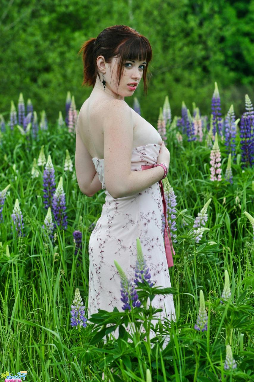 12P Amateur model Barbie A lifts up her dress while in an overgrown field