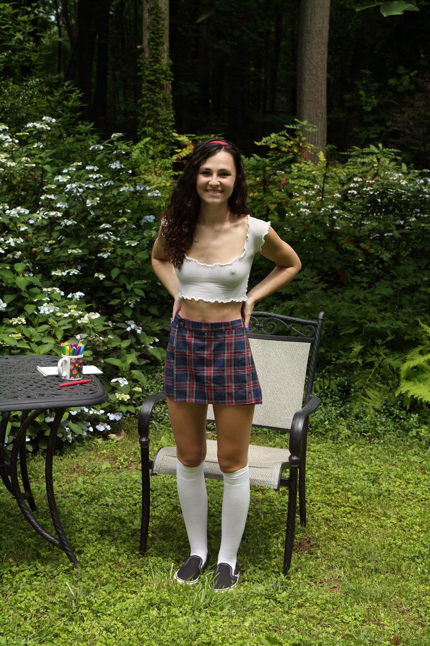 20P Smiley teen Liz Jordan inserts a bunch of markers into her pussy outdoors