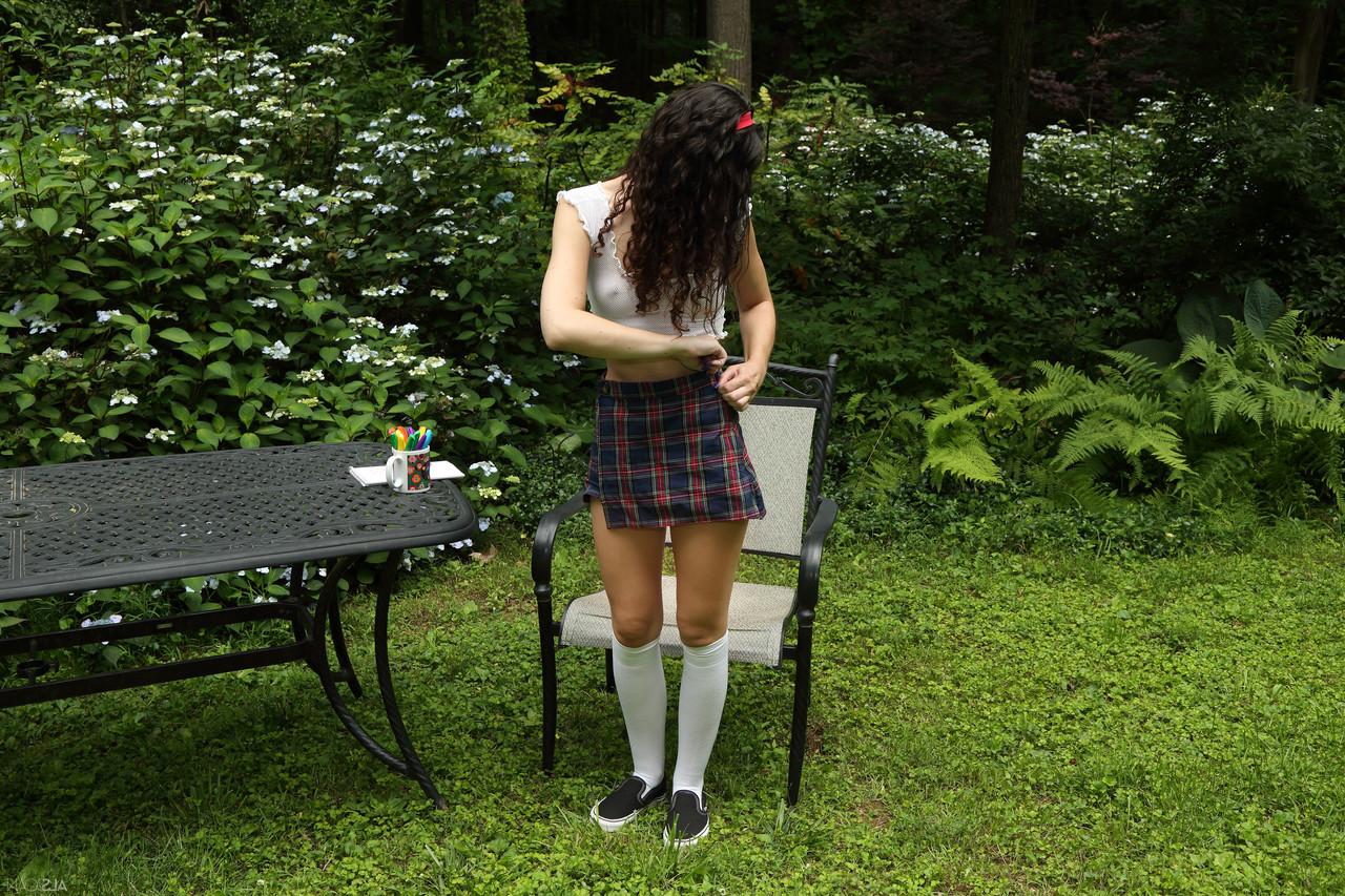 20P Smiley teen Liz Jordan inserts a bunch of markers into her pussy outdoors