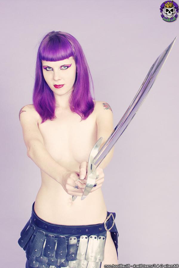 15P Goth girl Szandora wields a blade while going topless in a skirt