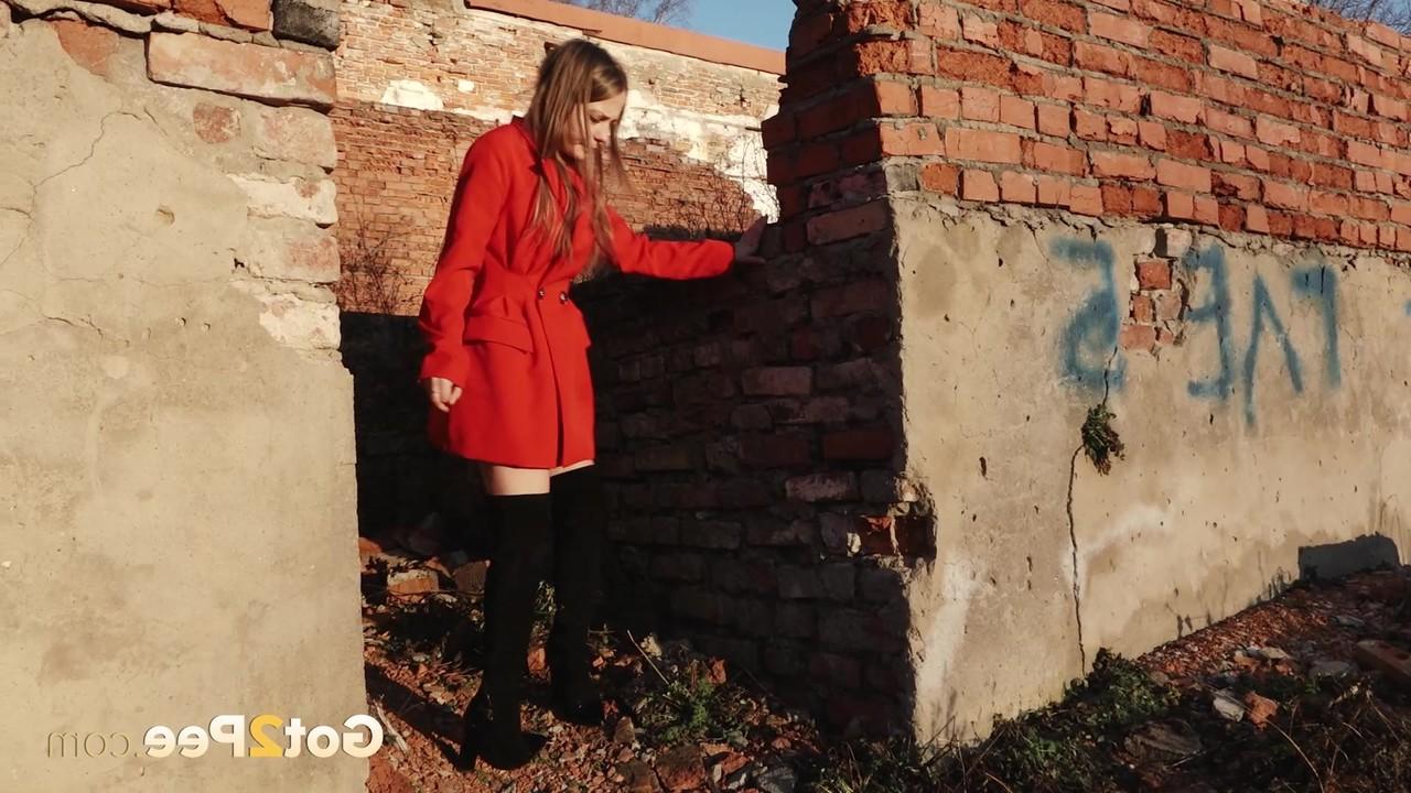 15P Caucasian girl Nastya takes a piss behind the remnants of a brick house