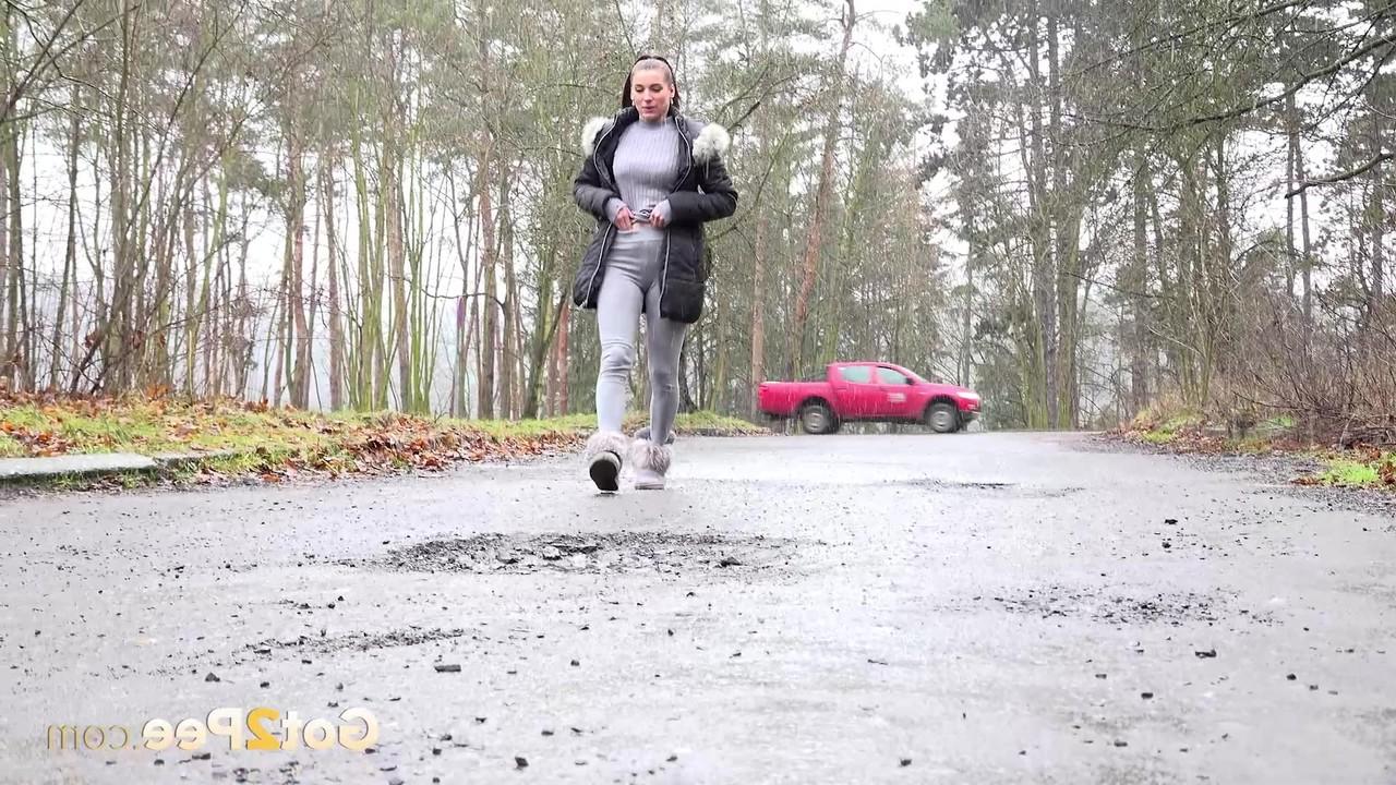 15P Victoria Daniels takes an urgent piss on a roadway in winter boots