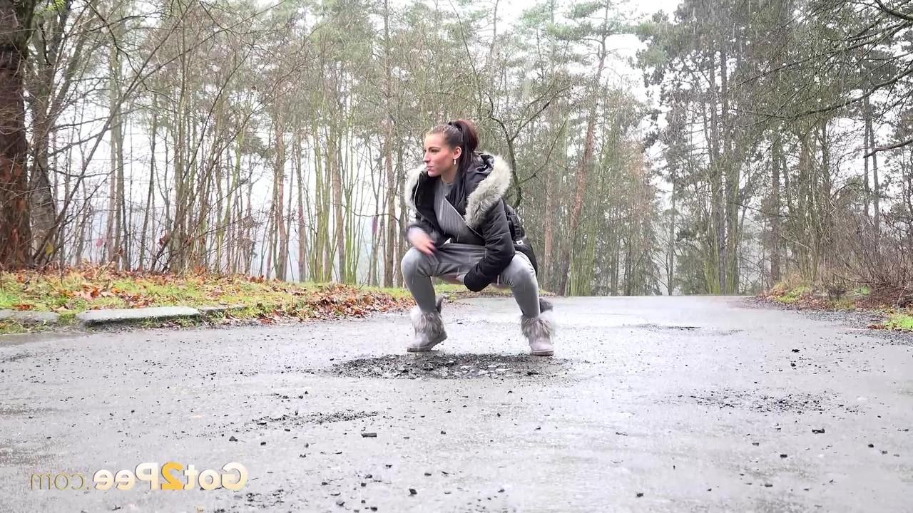 15P Victoria Daniels takes an urgent piss on a roadway in winter boots