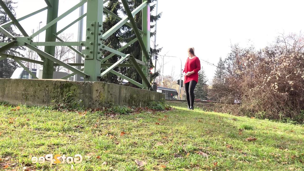 15P Caucasian chick Nikki Dream takes a badly needed pee near a hydro tower