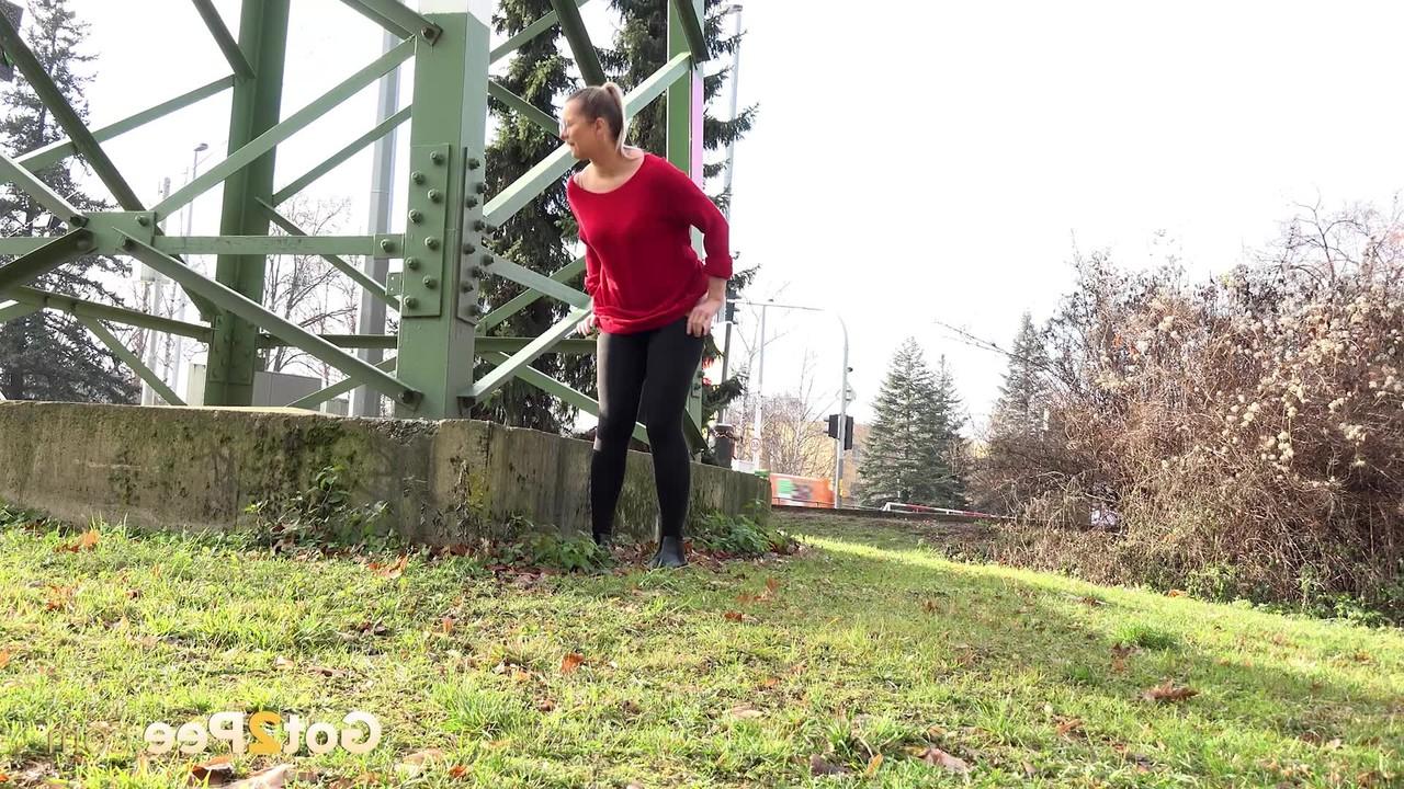 15P Caucasian chick Nikki Dream takes a badly needed pee near a hydro tower