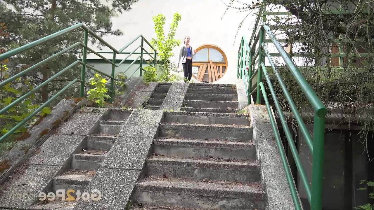 15P Brunette girl Elena gets caught taking a pee on a flight of concrete steps