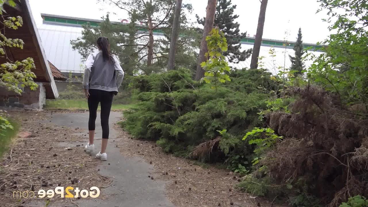 15P Brunette girl Elena gets caught taking a pee on a flight of concrete steps
