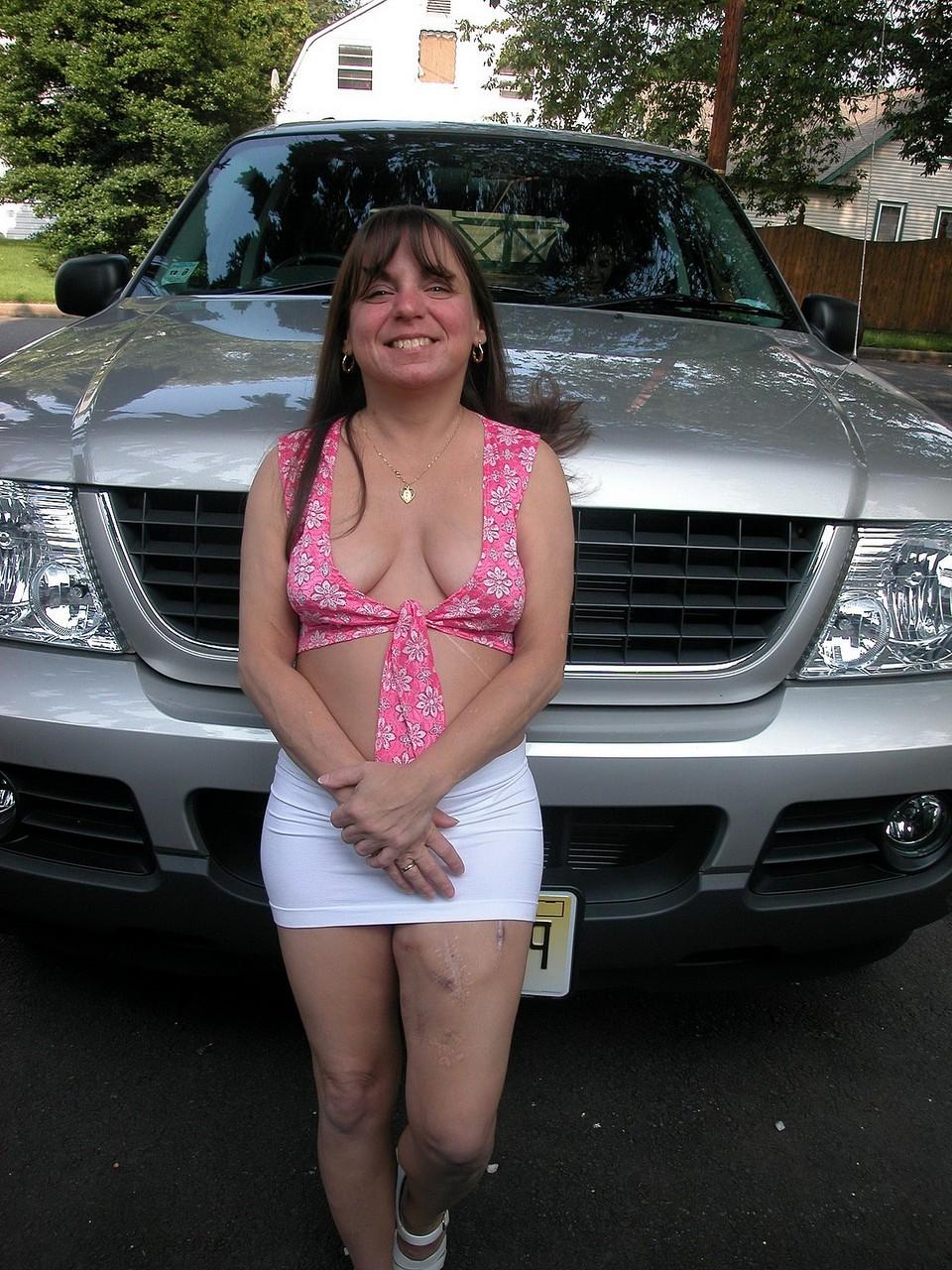 20P Petite MILF Vixen shows her shaved pussy and toys it in a truck